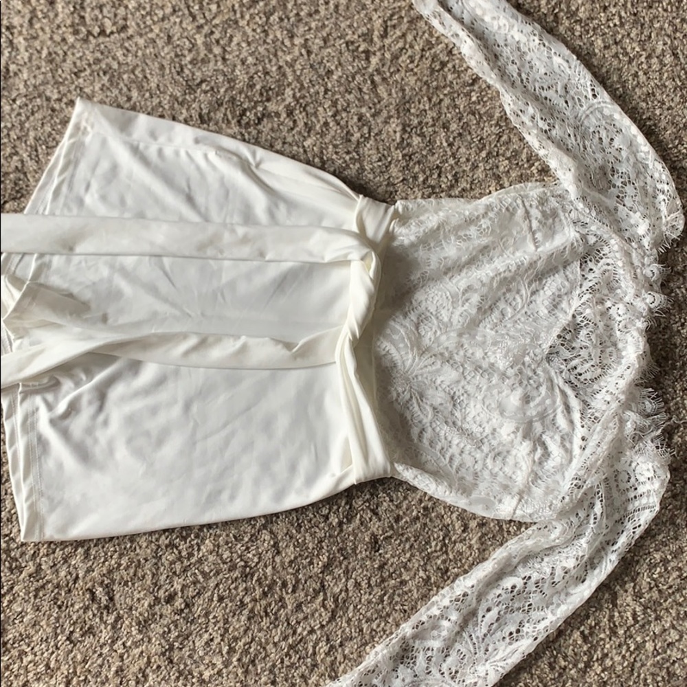 While lace off the shoulder romper